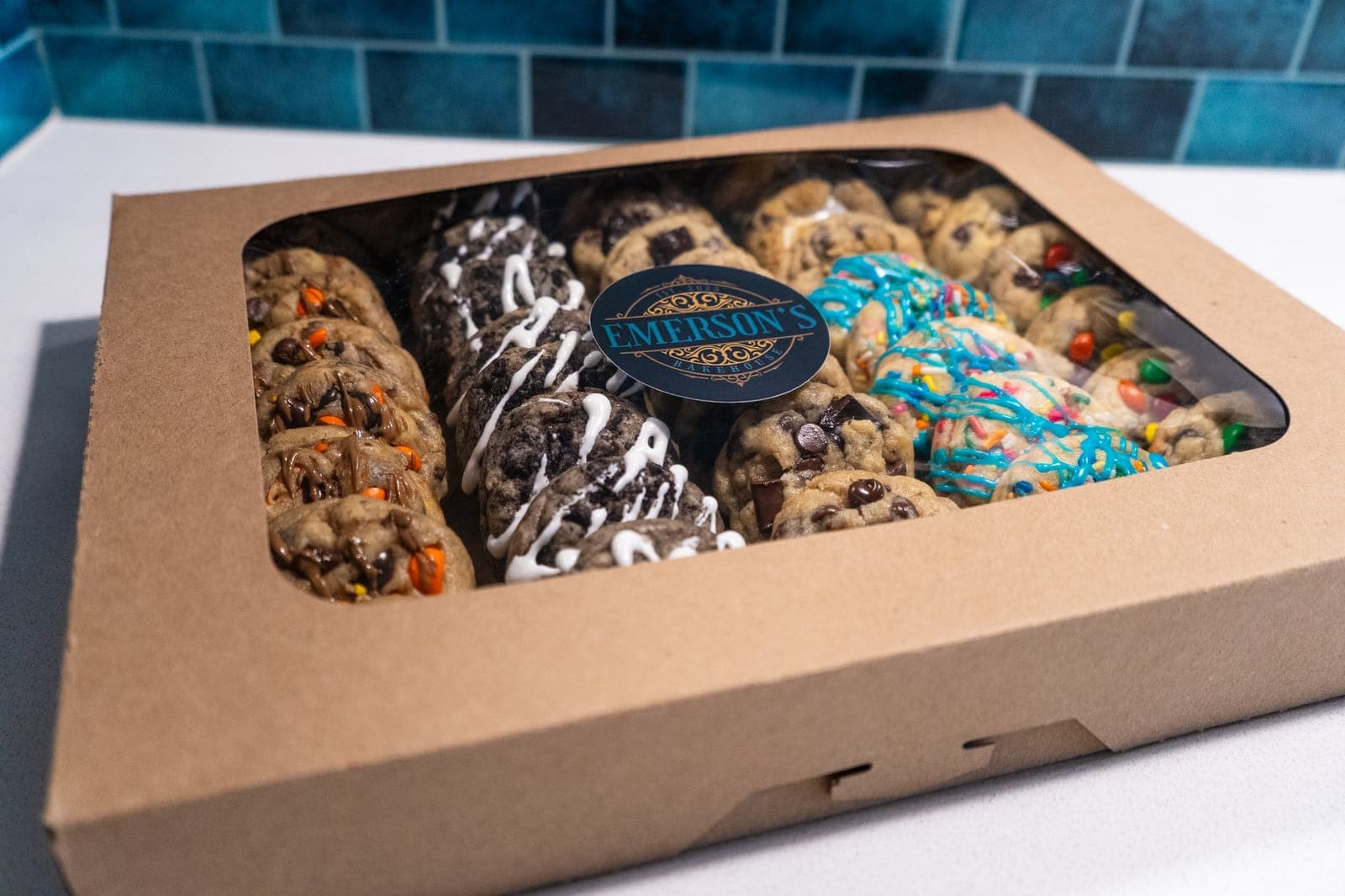 Mini cookie party pack in a kraft window box with the Emerson's Bakehouse sticker