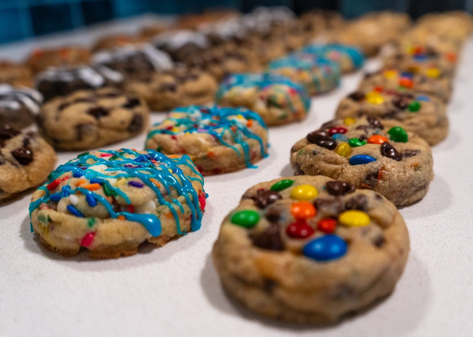 Close-up of mini birthday cake, M&M and chocolate chip cookies